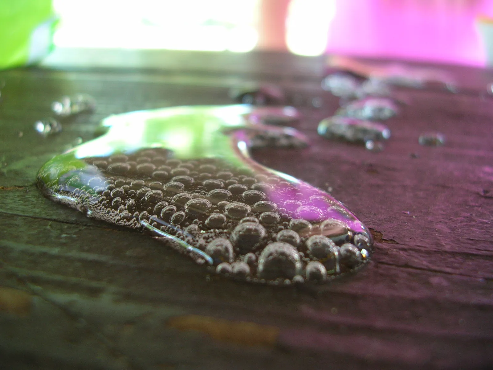 Glass of soda with ice showing carbonation bubbles