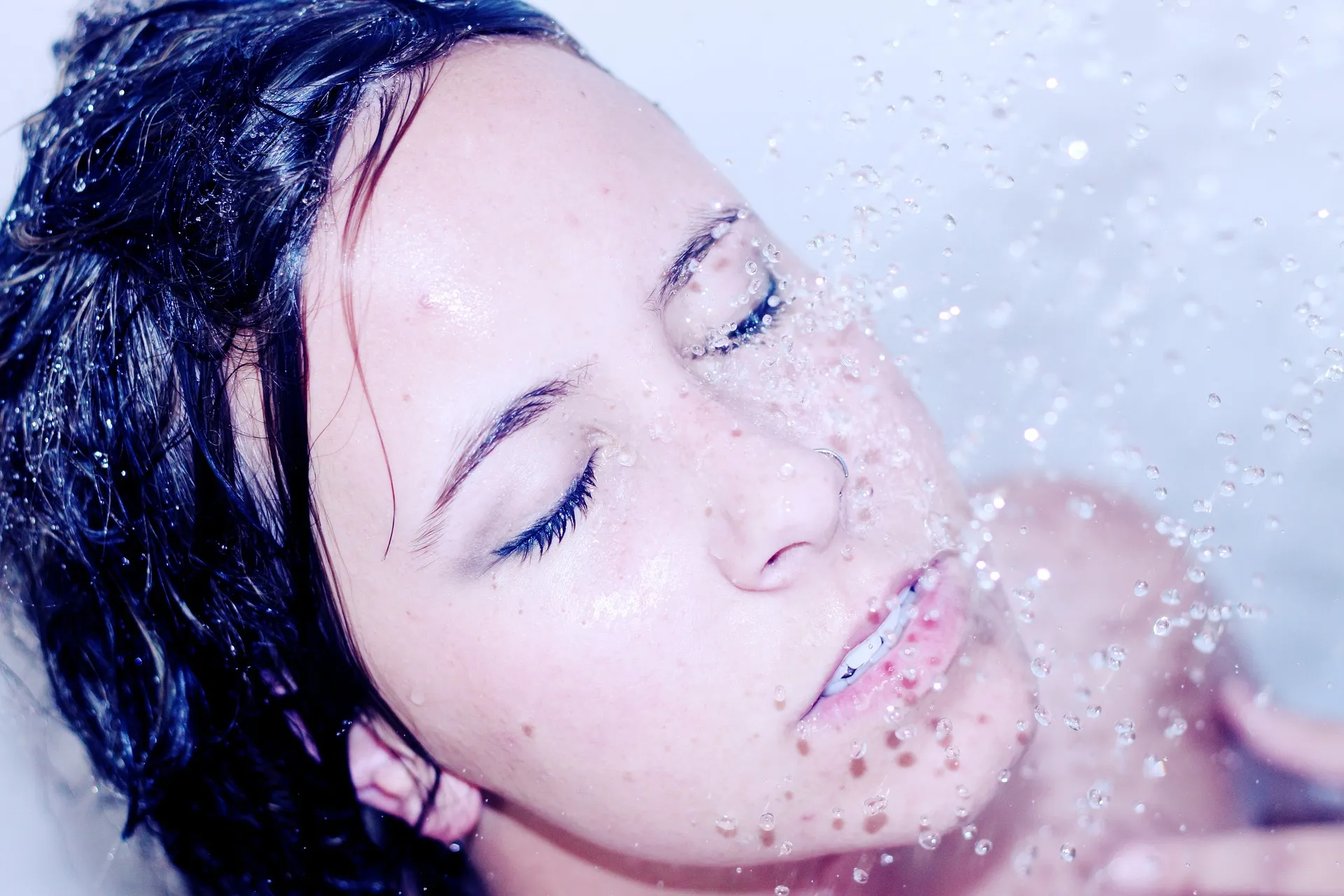 A person wearing stainless steel jewelry while showering